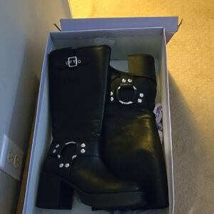 Black Heeled Boots with Circular Design Element